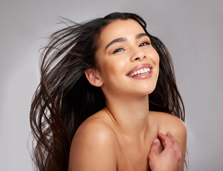 Portrait, woman and happy haircare in studio for growth, healthy shine and treatment transformation...