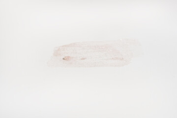 A smear of cream on a light background. Beauty concept.