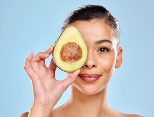 Woman, avocado and skincare portrait in studio for natural glow and vegan nutrition for skin...
