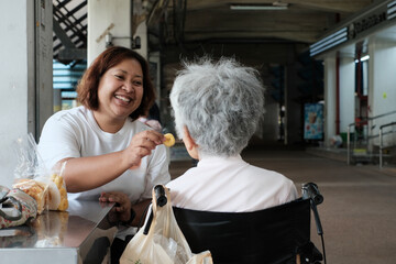 Young woman taking care of the elderly