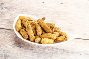 Raw ripe unpeeled peanut heap