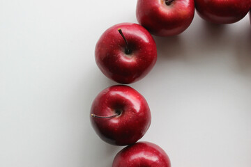 Juicy Red Apple Fruits Laid Out In Round Shape On Clean White Backdrop Top View. Stock Photo For Harvested Fruits Backgrounds