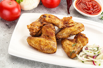 Grilled chicken wings with sauce