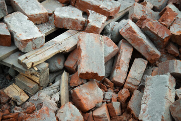 Pile of old bricks at a construction site. Building dismantling concept