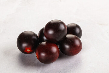 Raw ripe black kumato tomato