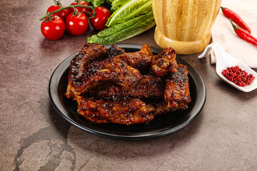 Grilled pork ribs in barbecue sauce