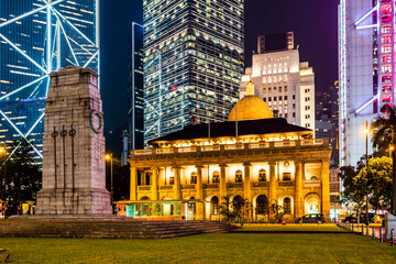 Night view of the Old Supreme Court Building exterior with skyscrapers background in Hong Kong, China.