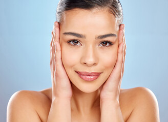 Skincare, woman and touching face in studio for beauty, glow and wellness or cosmetics. Model girl,...