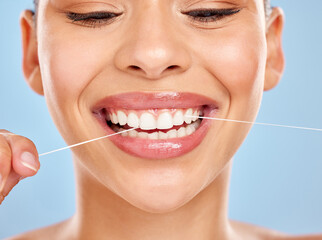 Dental floss, woman and wellness in studio for healthy gums, teeth whitening or morning routine on...