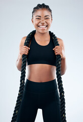 Portrait, black woman and battle rope for health, fitness and exercise in white background with happiness. Female person, African and excited for workout, training or cardio as athlete in studio