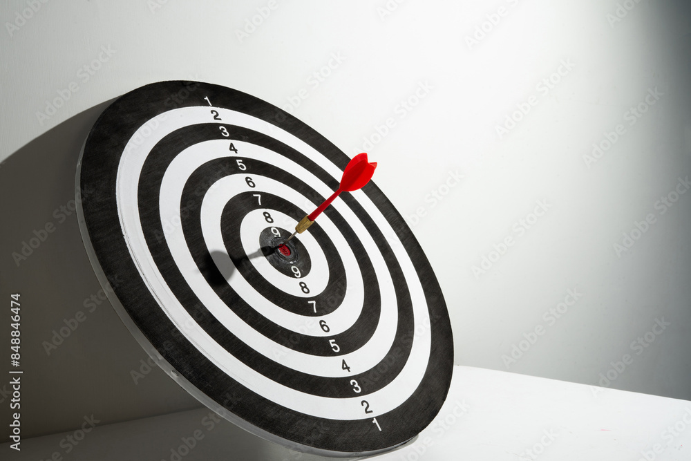 Poster red dart hitting target background