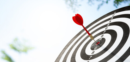 red dart hitting target background