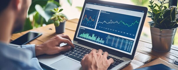 Productive Business Professional Analyzing Key Performance Indicators on Laptop with Digital Dashboard