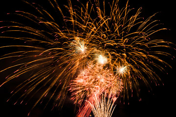 Close-up of colorful fireworks on a black background.