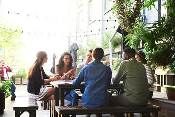 Creative, meeting and people in cafe for planning, talking and startup project development with teamwork at lunch. Collaboration, men and women in coffee shop with discussion, growth or design ideas