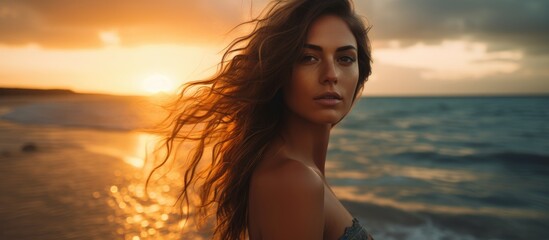 A stunning young woman poses stylishly at the beach during sunset with a captivating copy space image