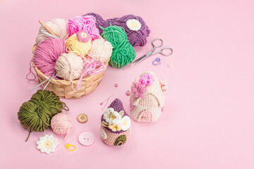 Handmade spring decor concept. Creative crocheting, house figurines, traditional flowers and stuff