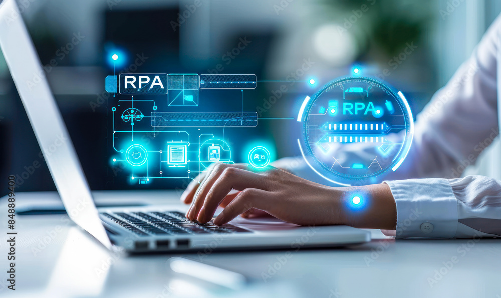 Poster person engaging with laptop and virtual interface for robotic process automation (rpa) system implem