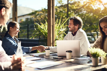 Business people, meeting and handshake at cafe for introduction, onboarding and remote work...