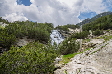 Small waterfall on Vlahina river in Pirin Mountains surrounded by beautiful nature scenery