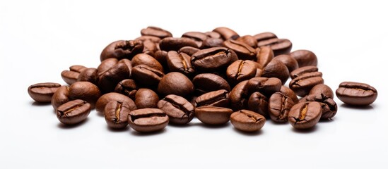 Fototapeta premium Close up view of coffee beans on a white background with copy space image