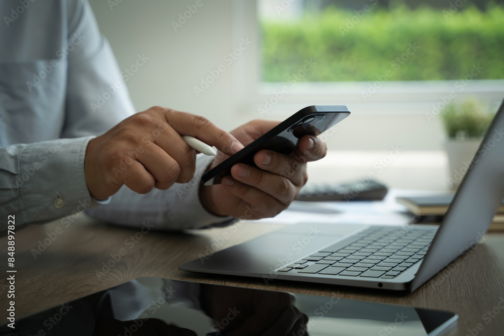 Poster man work using texting cell phone typing chatting on mobile contact us at office searching internet 