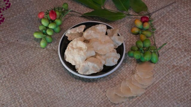 Emping crackers are typical Indonesian crackers which are often served as snacks. Emping crackers are a snack made from melinjo fruit or joint fir