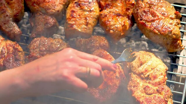 Rack of meat being cooked on grill. Frying marinated pork on BBQ
