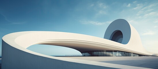 Modern building with futuristic architecture details features a cement curve shape against an abstract background providing a unique copy space image