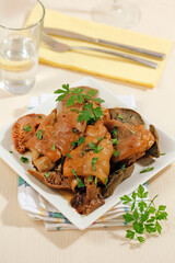 Pig trotters with mushrooms.