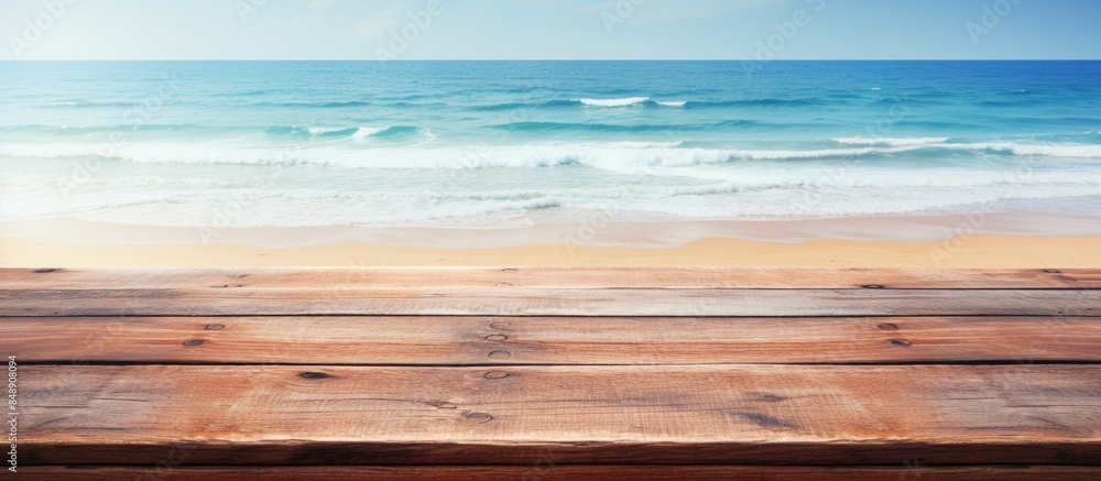 Poster rustic wooden tabletop on a beach backdrop for summer advertising with empty copy space image availa