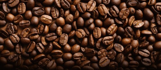 Fototapeta premium Close up background of roasted coffee beans with copy space image