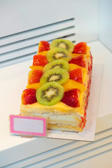 Fruit cake. Fruit cake with price tag. Delicious cakes made in the traditional way on the counter...