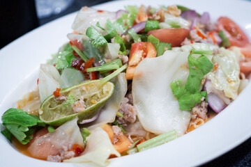 Thai salad is Spicy Glass Seaweed noodle Salad with Minced Pork.
