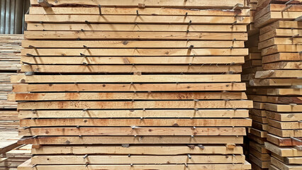 Stock pine log in furniture factory. Stacks of boards in a sawmill.  Wood timber pile building material industry