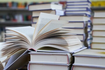 open book on the table. stack of books. back to school