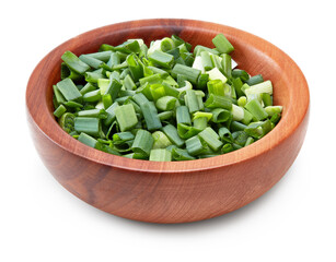 green onion in wooden bowl isolated on white background. clipping path