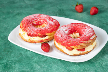 French dessert Paris-Brest made from choux pastry, strawberries and custard