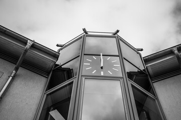old chimes above modern glass architecture