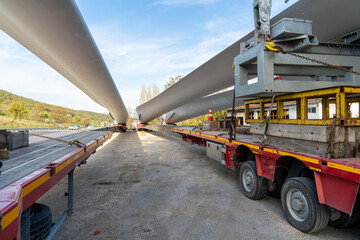 Naklejka premium Long Wind Energy wing (blades) for electricity generation. Transport on road by special long Truck