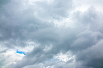 Rain clouds over a mountain range in the distance. Change of weather in the rainy season....