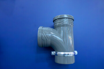 Gray plastic fitting, which is a component of the plumbing system. It is designed to connect the...