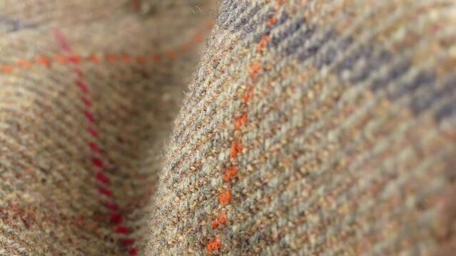 Tweed wool fabric material extreme rotating close up stock footage