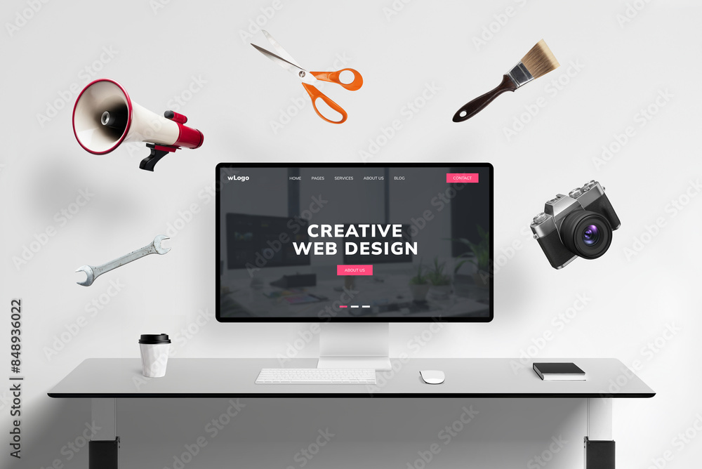Fototapete Web design studio page on display with flying concept web tools: megaphone, scissors, brush, photo camera, wrench key. Creative digital workspace visualized