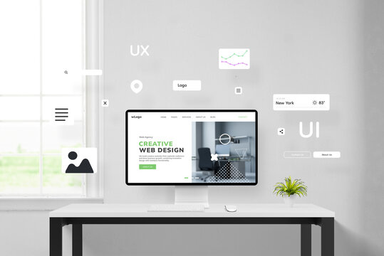 Office desk displaying the creation of a web page with elements flying around a concept web page on a computer display. Illustrating website arrangement and design process