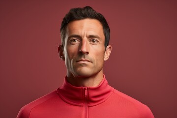Obraz premium Portrait of a tender man in his 30s wearing a thermal fleece pullover in front of solid color backdrop