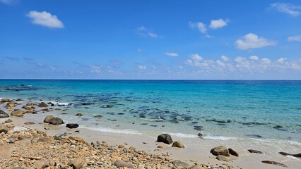 Beautiful beach at Con Son island, Vietnam, known as Con Dao island. Blue sky clouds, rock, sand, mountain and beach concept.