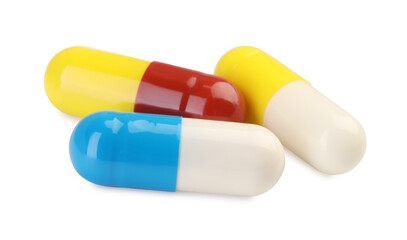 Three antibiotic pills isolated on white. Medicinal treatment