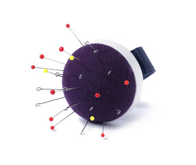 Blue pincushion with sewing pins isolated on white