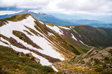 Wonderful nature. Rocky land, high mountains, dramatic sky.